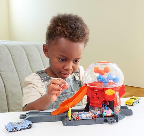 Hot Wheels Toy Car Track Set, Gumball Machine Playset with 1:64 Scale Die-Cast Donut-Shaped Vehicle & Speed Snap Track, Downtown City Candy Shop, JBM62