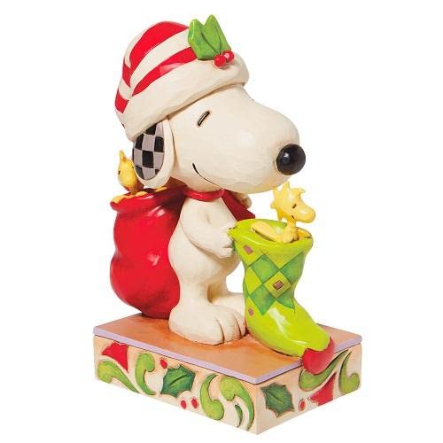 EnescoPeanuts by Jim Shore Snoopy with Woodstocks and a Stocking Figurine, 7 Inch, Multicolor