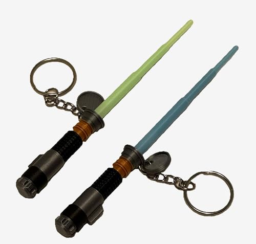 Mini llavero de espada láser con hoja que brilla en la oscuridad, paquete de 2, verde y azul, diseño retráctil
