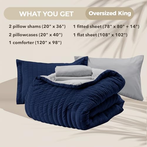 Image of HYMOKEGE Navy Blue /Light Grey Oversized King Comforter Set Seersucker 7 Pieces, All Season Luxury Bed in a Bag for Bedroom, Bedding Set with Comforter, Sheets, Pillowcases & Shams