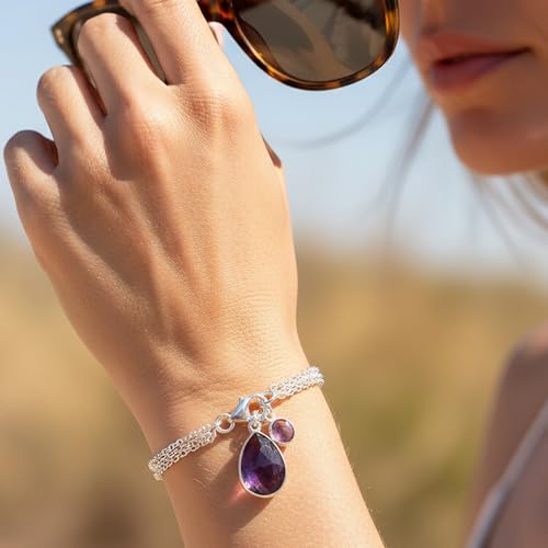 Image of NOVICA Artisan Handmade Amethyst Charm Bracelet Sterling Silver from India Purple Birthstone [7.5 in L x 0.2 in W Largest Piece 0.7 in H x 0.4 in W x 0.2 in D Smallest Piece 0.4 in H x 0.3 in W x 0.1]