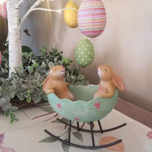 Lapins à bascule dans un œuf de Pâques pour centre de table champêtre