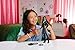 Mattel Universal Wicked Elphaba Fashion Doll & Accessories with Green Skin, Braided Black Hair, Posability & Removable School Uniform