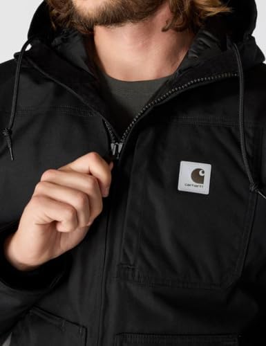 A person wearing the Carhartt Yukon Extremes Active Jac in snowy outdoor conditions, demonstrating fit and mobility.