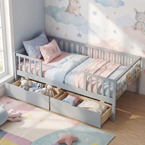 Grey twin bed frame with fence rails, two pull-out drawers and a side shelf — rails and drawers are what a first bed after a crib actually needs
