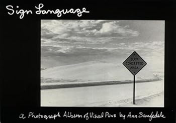 Paperback Sign Language: A Photograph Album of Visual Puns Book