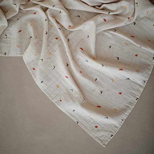Image of mushie Muslin Baby Swaddle Blanket | 100% Organic Cotton (Dinosaurs)