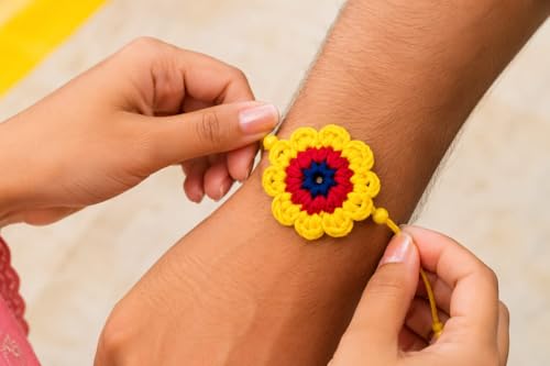 Image of Handmade Crochet Flower Rakhi for Kids, Red and Yellow, Cotton Yarn, Adjustable Knot, with Roli and Chawal, Raksha Bandhan