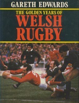Welsh rugby union player Gareth Edwards holding a real rugby boot