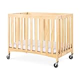 Foundations Travel Sleeper Compact Folding Wood Crib, 2" Foam Mattress and Oversized Casters, Natura