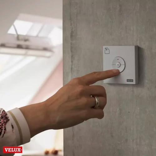 Hand pressing the VELUX KLI 311 US Keypad button