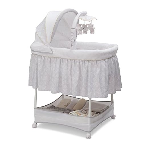 Simmons Kids Gliding Bedside Bassinet - Portable Crib with Activity Mobile Arm Featuring Spinning Toys, Vibration, Nightlight and Music, Peacock