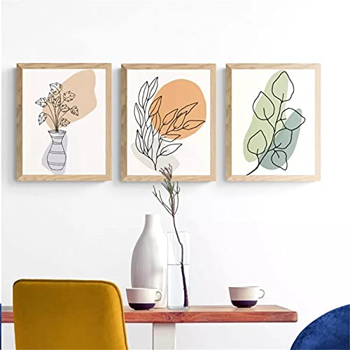 Art mural feuilles minimalistes pour illuminer la décoration de votre salon moderne