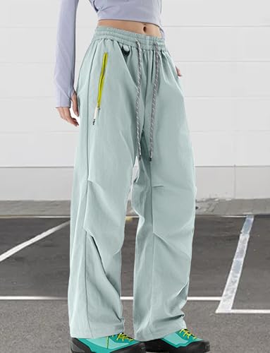 Image of FEOYA Waterproof Pants Women Light Rain Pants Parachute Drawstring Cuffs | Elastic Drawstring Waist,Zipper Large Pockets,Quick-Dry Water-Repellent Baggy Cargo Pants,Camping Hiking Pants Travel Casual