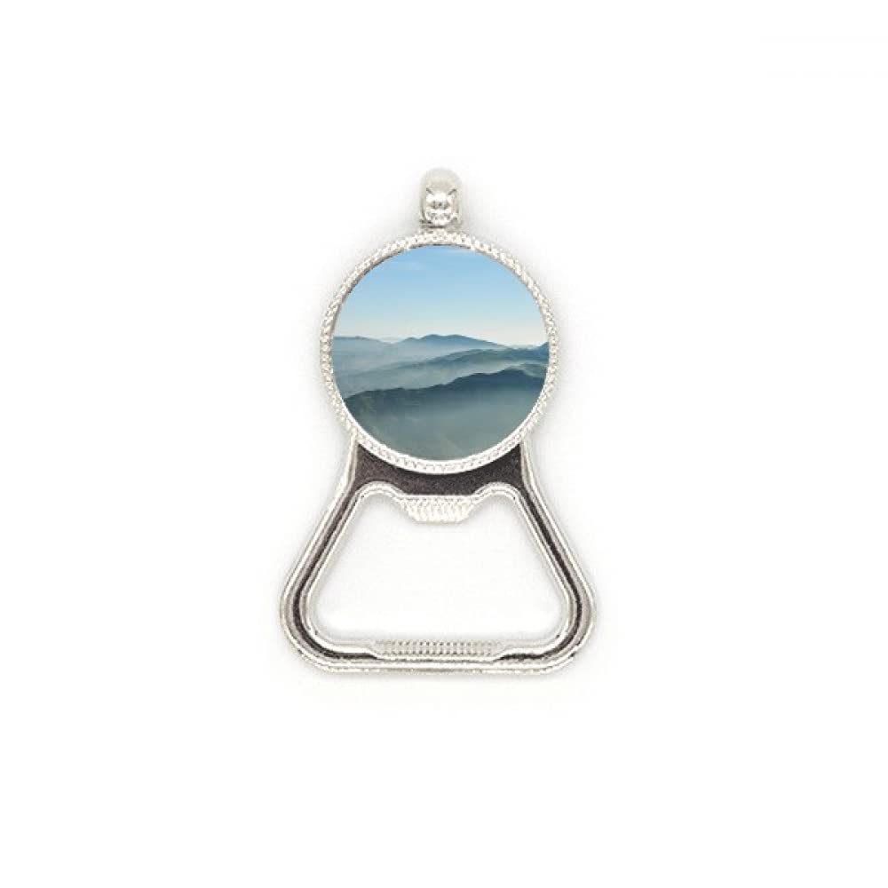 Décapsuleur acier inoxydable Sunshine Mountains au motif ciel de brume