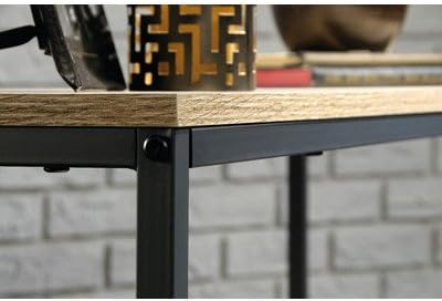 Close-up of table corner showing metal frame and wood top connection