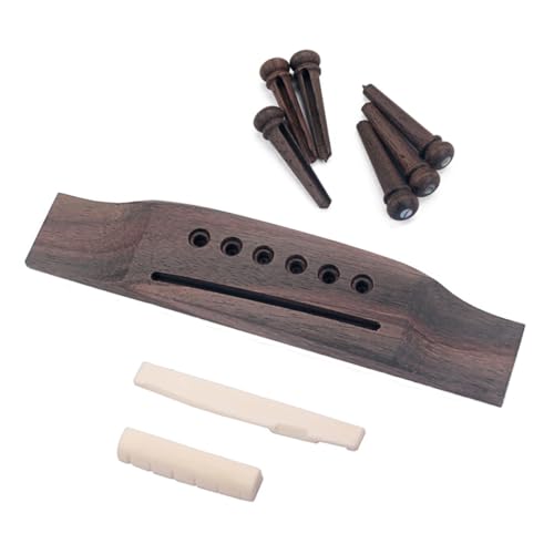Chevalet de guitare en os et chevilles en bois contre les cordes qui sautent