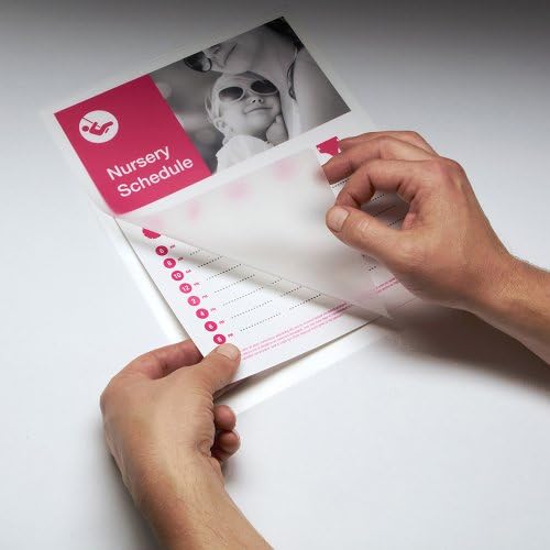 Hands preparing a document inside a laminating pouch