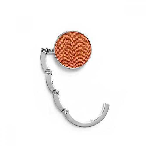 Cintre porte pliable pour ne plus poser son sac propre au sol