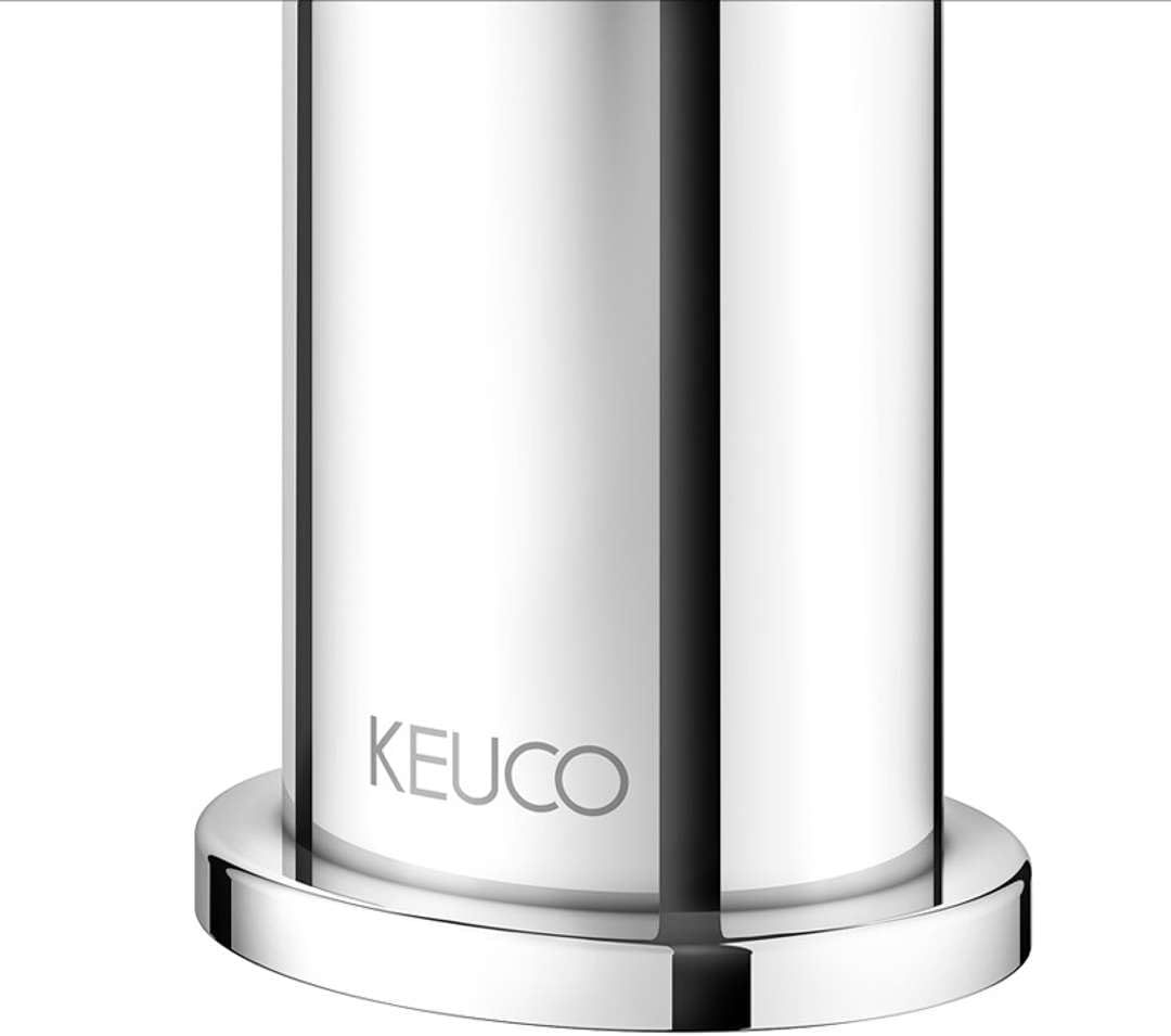 Close-up of the Keuco logo at the base of the tap