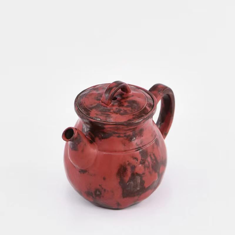 Tetera de cerámica tradicional para preparar té en la cocina 4
