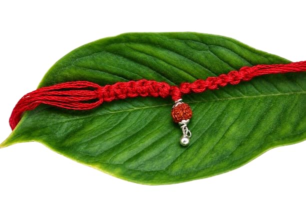 handmade silver rakhi with rudraksha and pearl beads