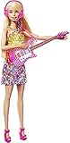 Se si porta il microfono alla bocca di Barbie, inizia la musica, il vestito si illumina e lei canta una delle due canzoni originali
