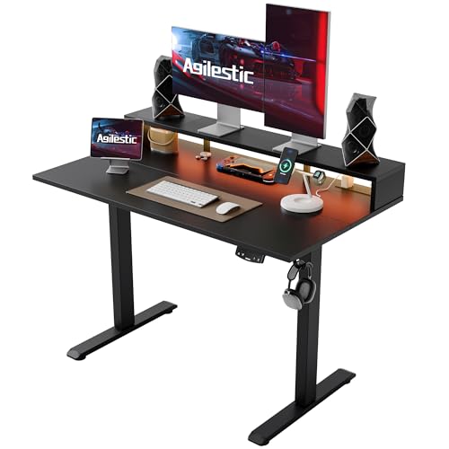 Image of Agilestic 48x24 Inch Electric Standing Desk with Shelf, Height Adjustable Desk with Power Outlets & LED, Sit Stand Up Table with Monitor Stand, Computer Workstation, Black