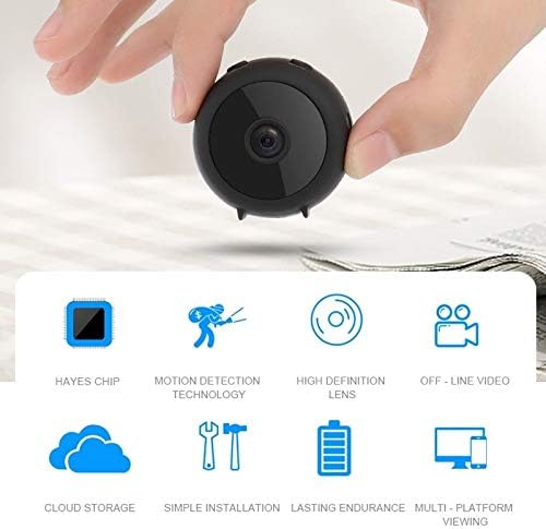 A hand holding the small DINGXUEMEI DXM Security Camera A11, emphasizing its compact size