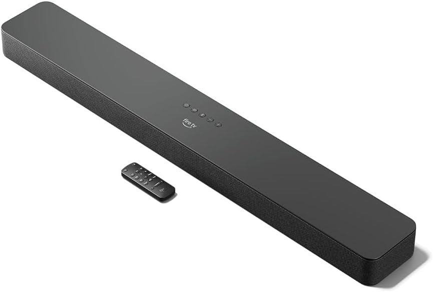 ടോപ്പ് ഡൗൺ view of the Fire TV Soundbar Plus with its remote control placed next to it