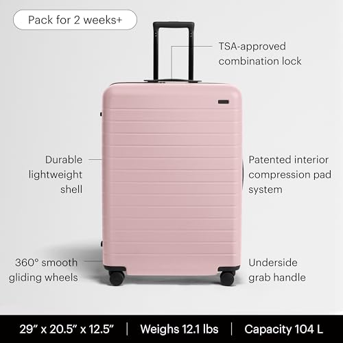Image of Away Large Checked Luggage - 29-Inch Lightweight Hardside Suitcase with Four WhisperGlide 360 Spinner Wheels, Interior Compression System, TSA-Accepted Lock - Blush Pink