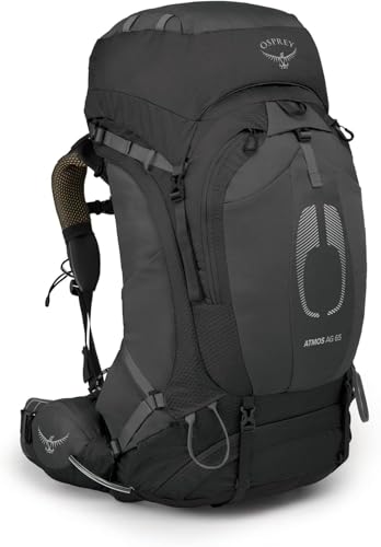 Osprey Atmos AG 65 men's multi-day backpacking pack in mythical green colorway photographed in a 3/4 angle showing the AntiGravity 3D-tensioned suspended-mesh back panel that wraps from the lumbar through the back panel onto the shoulder straps — the FitOnTheFly adjustable hip belt is visible at the bottom, the integrated rain cover stowed at the base, and the 65L main compartment with sleeping bag access at the bottom