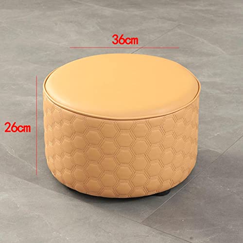 Pouf en cuir jaune idéal comme tabouret de change au balcon