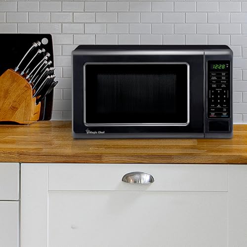 Image of Magic Chef 0.7 cu. ft. Countertop Microwave in Black - 700W (10.1 inchH x 17 inchW x 12.5 inchD) MC77MB