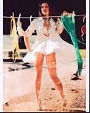 Posterazzi Danielle Fishel Hanging Laundry In Lingerie Photo Print (16 x 20) - Item # MVM54837