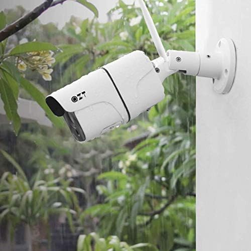 QZT outdoor camera mounted on a wall, shown being exposed to rain, illustrating its IP66 waterproof rating.