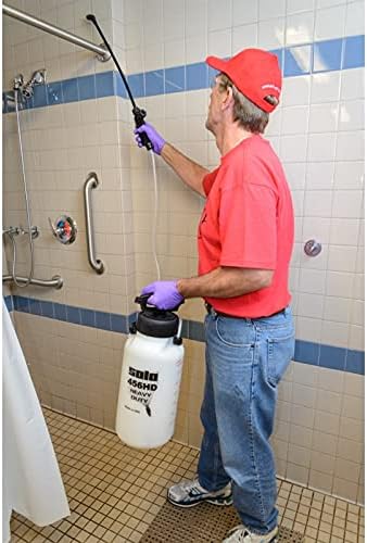 Man spraying solution on a wall with SOLO 456-HD sprayer