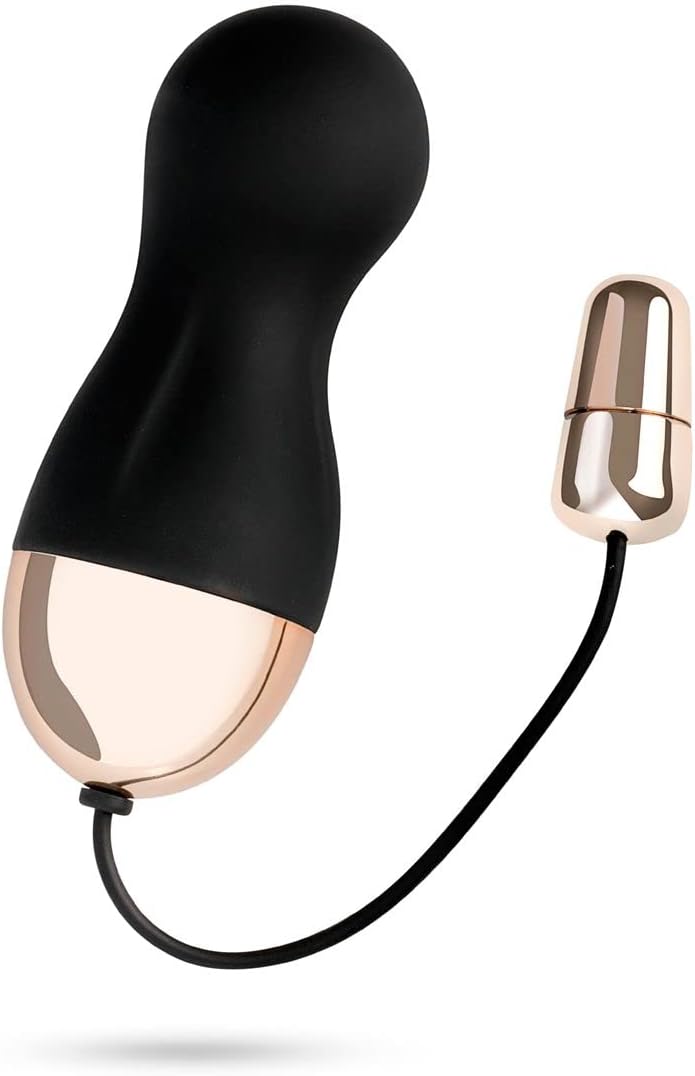 Vibrating egg with remote control, showing the egg connected to a charging cable.