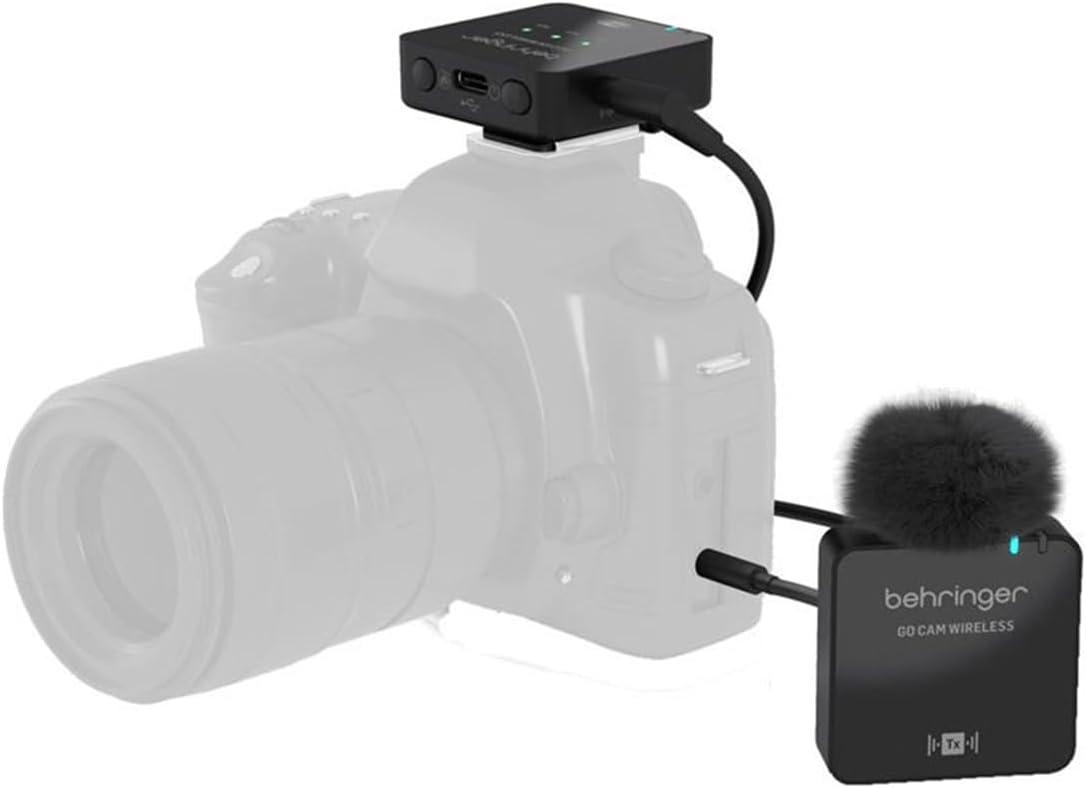 Behringer GO CAM Wireless receiver mounted on a camera hot shoe and connected via cable, with the transmitter unit placed nearby, also connected via cable.