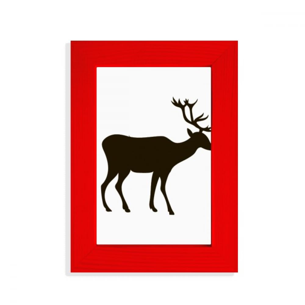 Cadre photo cerf noir pour créer une ambiance chalet scandinave dans le salon