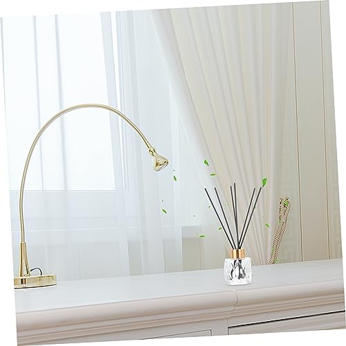 Set decorativo con botellas de aromaterapia y varillas de ratán miniatura 5