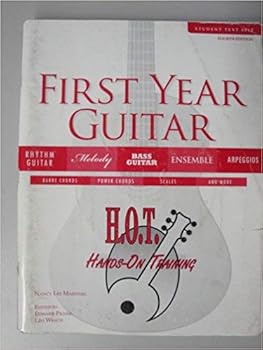 Paperback FIRST YEAR GUITAR-W/CD Book