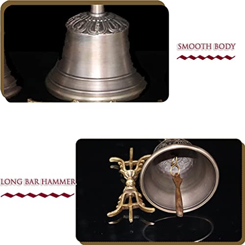 Close-up of the hand bell's handle and hammer