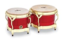Shell: siam oak Heads: 7 1⁄4" and 8 5/8" natural rawhide Traditional rims Hardware: gold 5/16" tuning lugs and cast aluminium bottoms Red, gold hardware