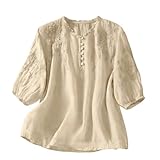 Blouse présente des broderies florales placées sur haut du buste et les manches, réalisées avec soin pour offrir un aspect visuel délicat. Les finitions sont travaillées pour assurer durabilité et résistance du vêtement lors des lavages répétés.