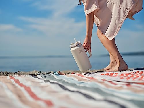 Image of STANLEY Quencher H2.0 Tumbler with Handle & Straw 64 oz | Flowstate 3-Position Lid | Large Capacity for Travel & Sports | Insulated Stainless Steel Cup | BPA-Free | Cream