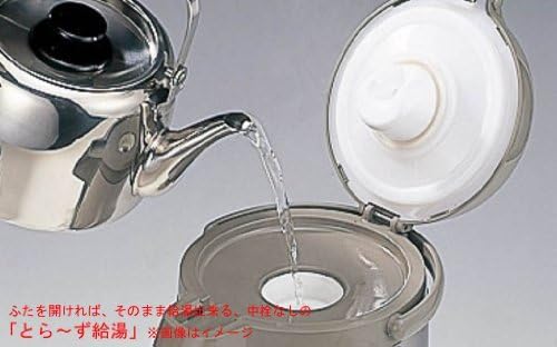 Pouring hot water from a kettle into the open Tiger Air Pot.