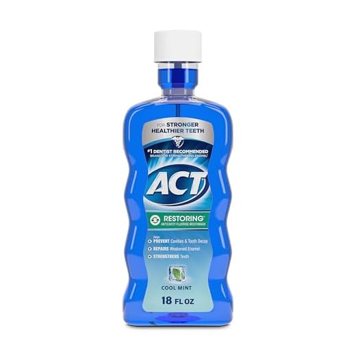 ACT Restoring Fluoride Mouthwash 18 fl. oz. Strengthens Tooth Enamel, Cool Mint