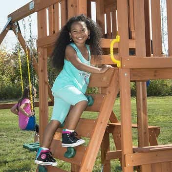 Child climbing playset ladder