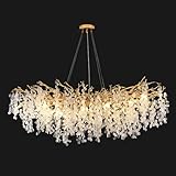 [Lustre moderne Art déco : le luxe rencontre la romance] Ce lustre contemporain en cristal doré redéfinit l'éclairage de plafond avec son design époustouflant, doté d'un élégant cadre de branche d'arbre à finition dorée associé à des feuilles de cristal étincelantes. Les cristaux brillent comme de vrais diamants émettant une pure lueur romantique qui ajoute une touche organique et moderne à n'importe quel espace. Plus qu'un simple luminaire, c'est une pièce maîtresse qui